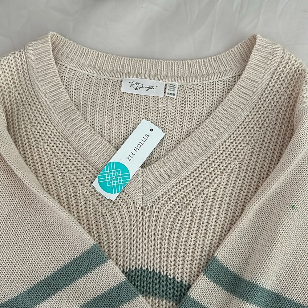 Medium stripped tan and teal V neck sweater